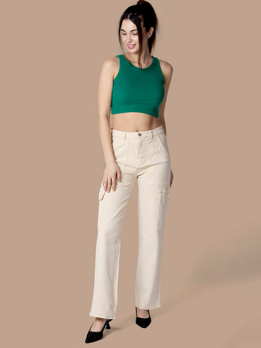A fashionable woman wearing white cargo pants from OMG Jeans, paired with a green crop top and white sneakers, posing stylishly against a black background.
A fashionable woman wearing white cargo pants from OMG Jeans, paired with a green crop top and white sneakers, posing stylishly against a black background.